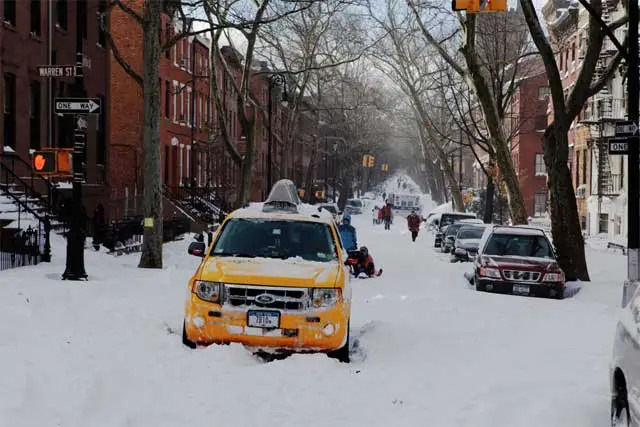 A stuck cab in Brooklyn Monday. Behind it an ambulance going the wrong way is also stuck